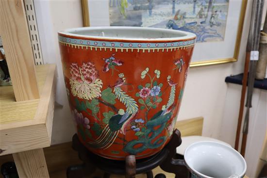A Chinese coral ground famille rose jardiniere, wood stand Total height 60cm